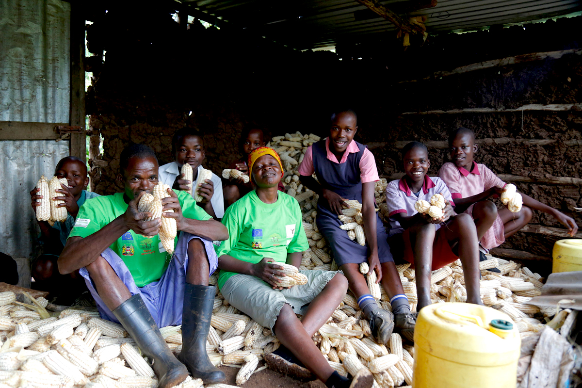 regreening-project-family-with-maize-harvest-world-vision-kenya-brian-wambua.jpg