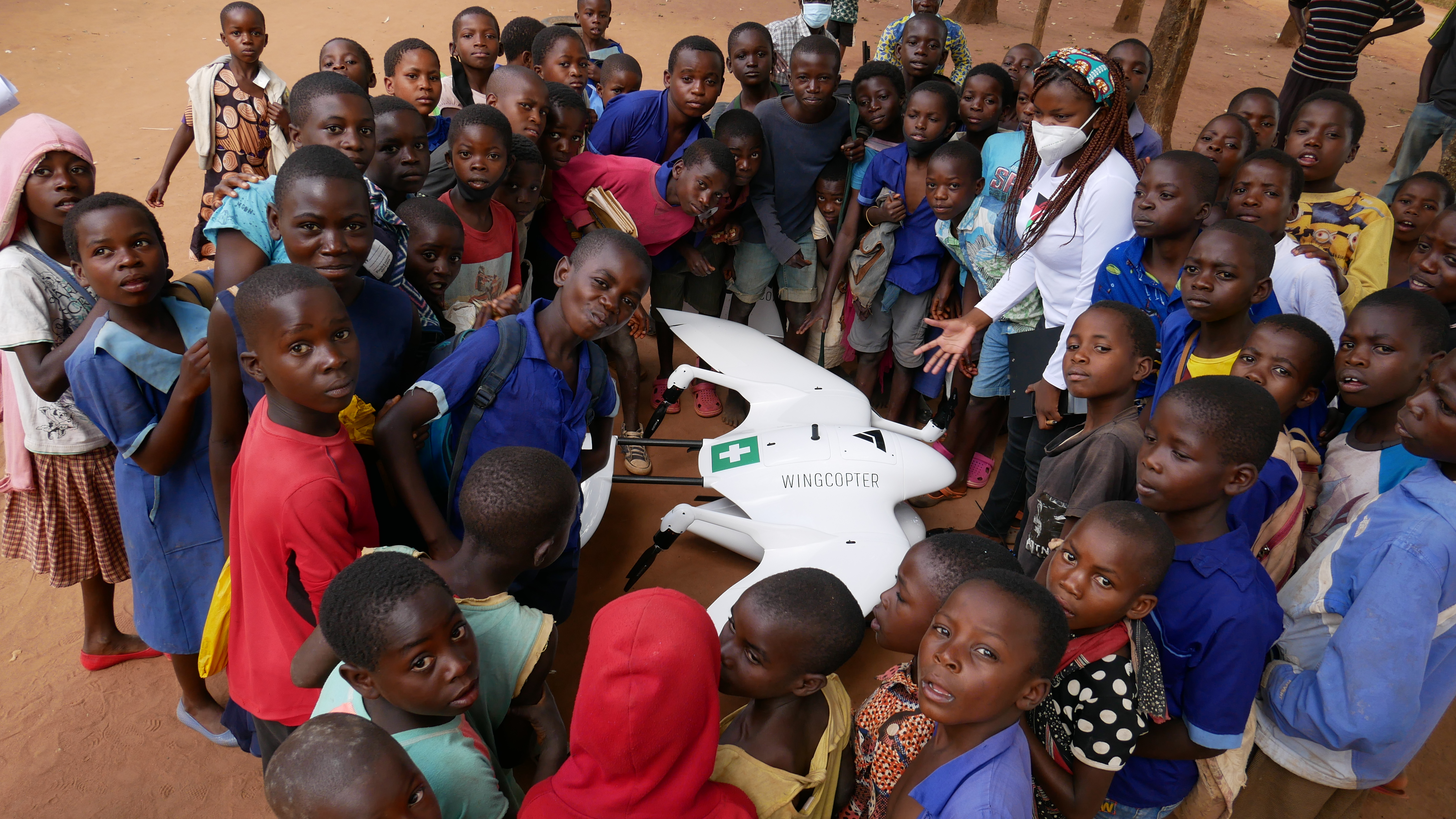 Drones and Data Aid team with children in Malawi, inspiring the next generation to reach for the skies.