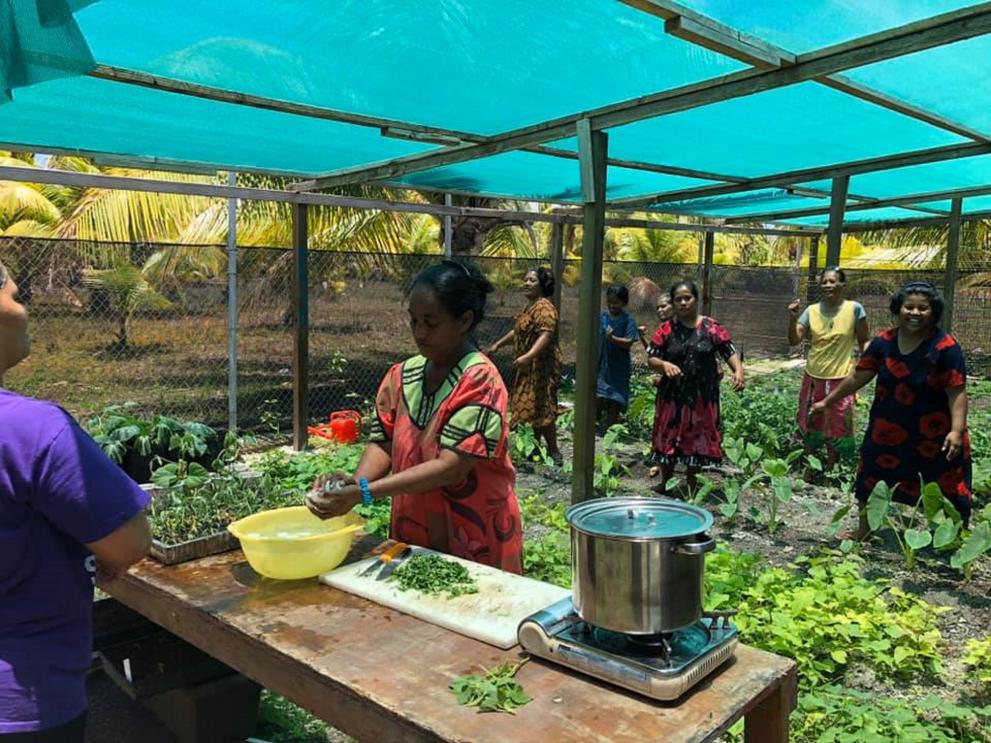 Women in the newly established nursery learning to cook with local vegetables, whilst enjoying an exercise class, Ailuk Atoll, Republic of the Marshall Islands