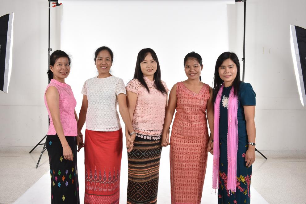 Nan Zar Ni Myint, pictured at far right, meets with follow migrant domestic workers to share knowledge and experiences.