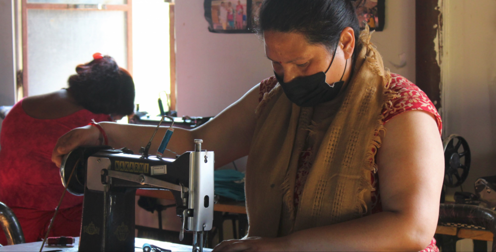 Woman stitching face masks in Nepal
