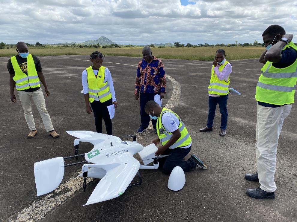 Drones and Data Aid launching a drone with health supplies.