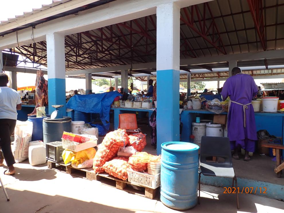 A booth with several products at a food market in The Gambia
