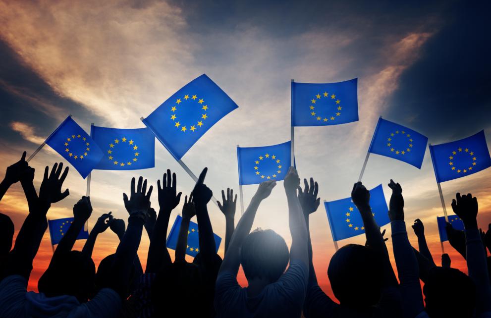 People holding EU flags