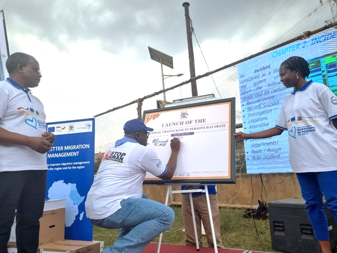 IOM chief of mission Sanusi Tejan Savage launches the National TiP Database with his signature.