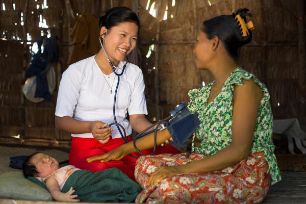 Midwife providing a young mother and her newborn with essential health services in Ayeyarwady Region