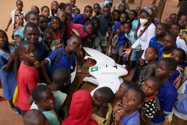 Drones and Data Aid team with children in Malawi, inspiring the next generation to reach for the skies.